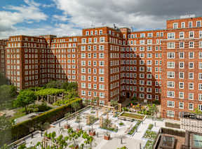 A large red brick building with the words "Dolphin Square" on the front.