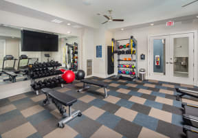 a spacious fitness center with treadmills and other exercise equipment  at Promenade at Newnan Crossing, Newnan, Georgia