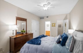 living area with table chairs and bookshelf  at Creekview Apartment Homes, Texas, 75254