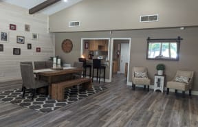 a dining room and living room with a table and chairs