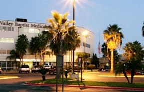 A building with the words Valley Baptist Medical Center on it.