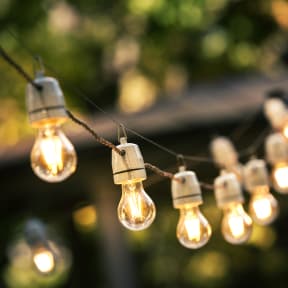 a string of light bulbs hanging from a wire
