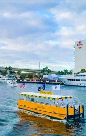A yellow boat with the words "More Vac" written on it is in the water.