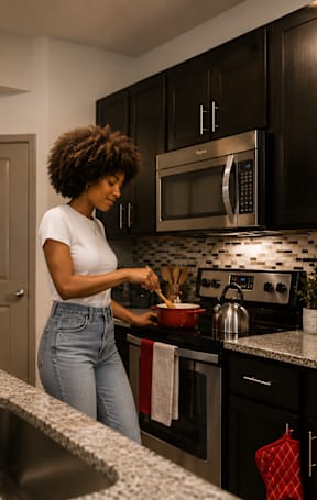 A kitchen with a sink, microwave, and refrigerator.
