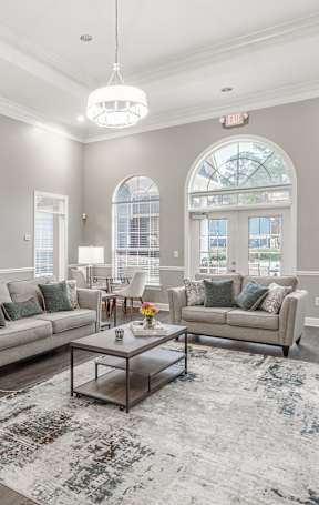 a living room and dining room with a couch and a table