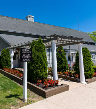 a white house with a driveway and a garage door