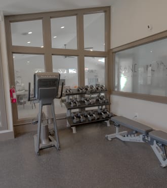 a gym with treadmills and other exercise equipment in a home