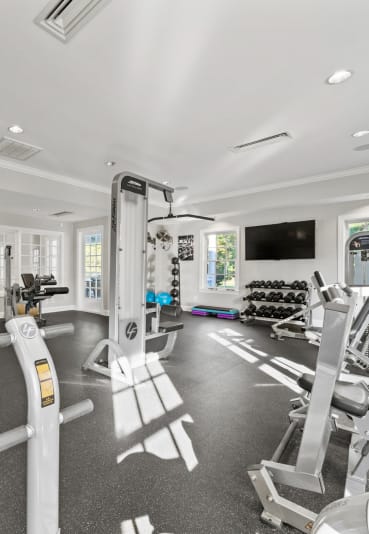 a gym with a lot of exercise equipment in it at Sterling Manor, Williamsburg Virginia