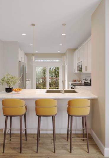 A modern living room with a kitchen area in the background.