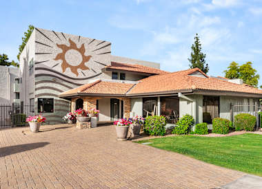 Apartment buildings and shared grounds at Villa Toscana