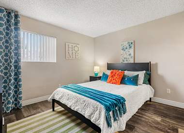 Furnished model bedroom at Villa Toscana