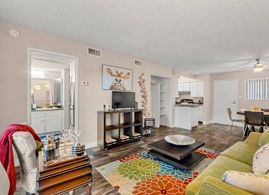 Furnished model living and dining area at Villa Toscana