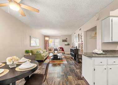 Furnished model living and dining area at Villa Toscana