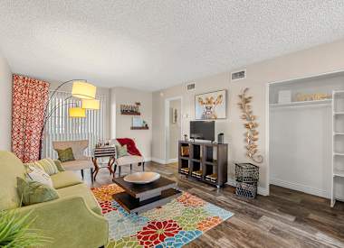 Furnished model living and dining area at Villa Toscana