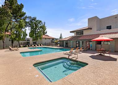 Community swimming pool and surrounding deck at Villa Toscana