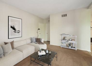 Furnished apartment living area shown at Vertu Apartments.