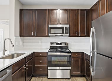 Las Brisas Apartments kitchen with stainless appliances - Round Rock, TX