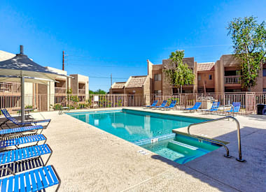 Pool and poolside area at Boulder Creek Apartments.