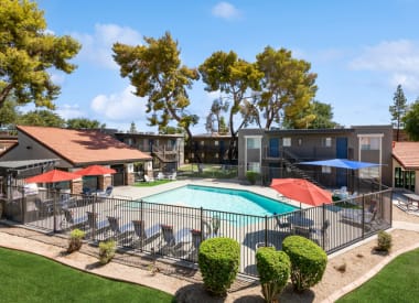 Community swimming pool and surrounding deck at Villages at Metro Center