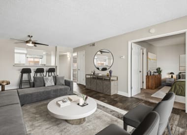 Furnished model living and dining area at Villages at Metro Center