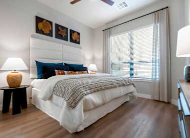 Furnished bedroom shown at Seven Oaks.