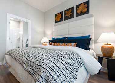 Furnished bedroom shown at Seven Oaks.