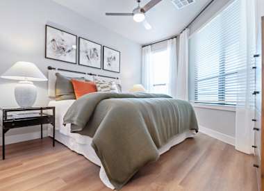 Furnished bedroom shown at Seven Oaks.