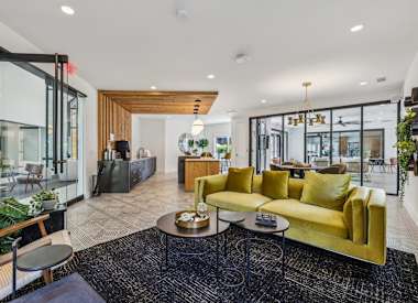 Wesley St. Claire Apartments at Lawrenceville lounge with sofa and coffee tables - Lawrenceville, GA