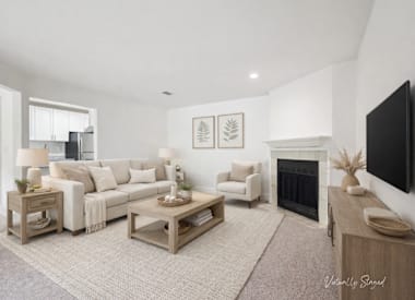 Wesley Trevento Apartments at Lithia Springs living room with sofa and fireplace - Lithia Springs, GA