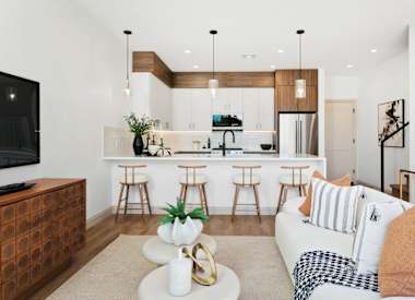 Furnished apartment living area shown — representative home at 56th at Arcadia.