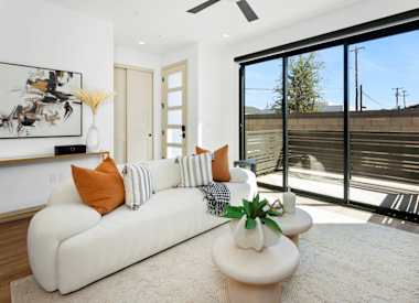 Furnished apartment living area shown — representative home at 56th at Arcadia.