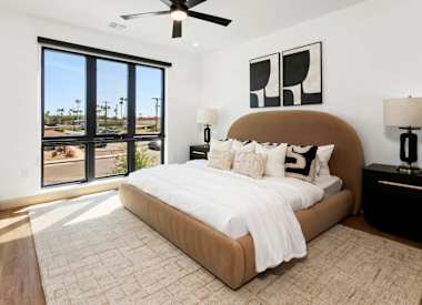 Furnished bedroom shown — representative home at 56th at Arcadia.