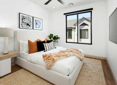 Furnished bedroom shown — representative home at 56th at Arcadia.