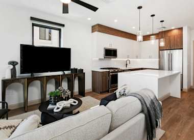 Furnished apartment living area shown — representative home at 56th at Arcadia.