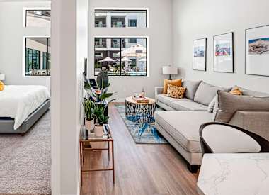 Furnished apartment living area shown at Union at Roosevelt I and II.