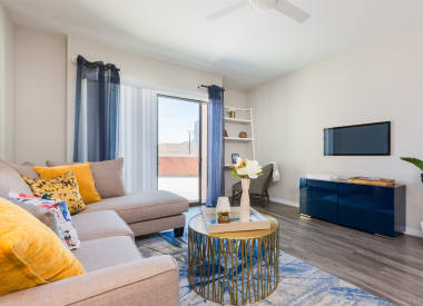 Furnished apartment living area shown at Union at Roosevelt I and II.