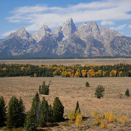 a view of the grand teton mountains and the snake river valley