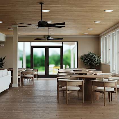 a modern dining room with a large table and chairs.