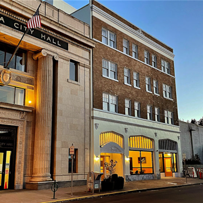 the exterior of the historic storonia city hall building is shown.