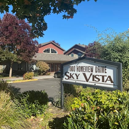 a photo of the sky vista sign in front of the building