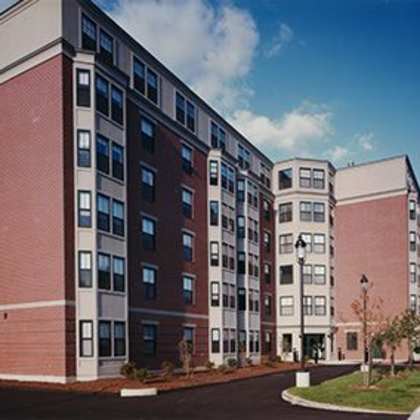 apartment buildings with a mix of red and beige facades.