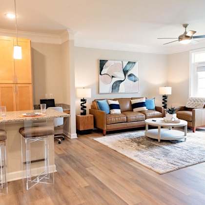 spacious living room with ceiling fan