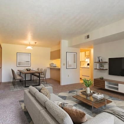 a living room with a grey couch and a coffee table.