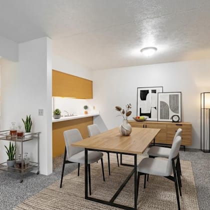 a dining room with a table and chairs.