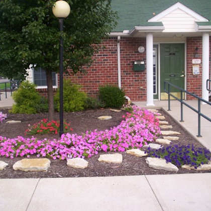 a flower garden in front of a building