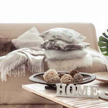 a coffee table in a living room with a plate of cookies on it