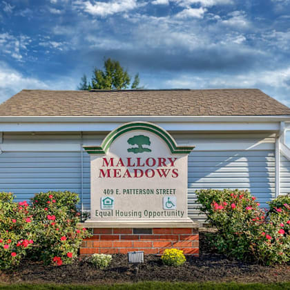the mallory meadows sign on the front of a building