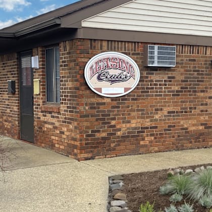 a brick building with a sign on the front of it