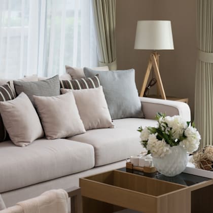 a living room with a white couch and a coffee table