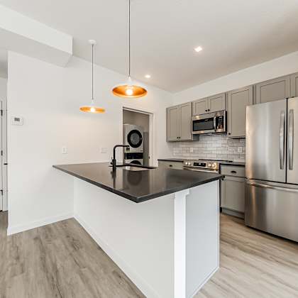 a modern kitchen with stainless steel appliances and a central island at westwood meadows, westlake, oh, 44145